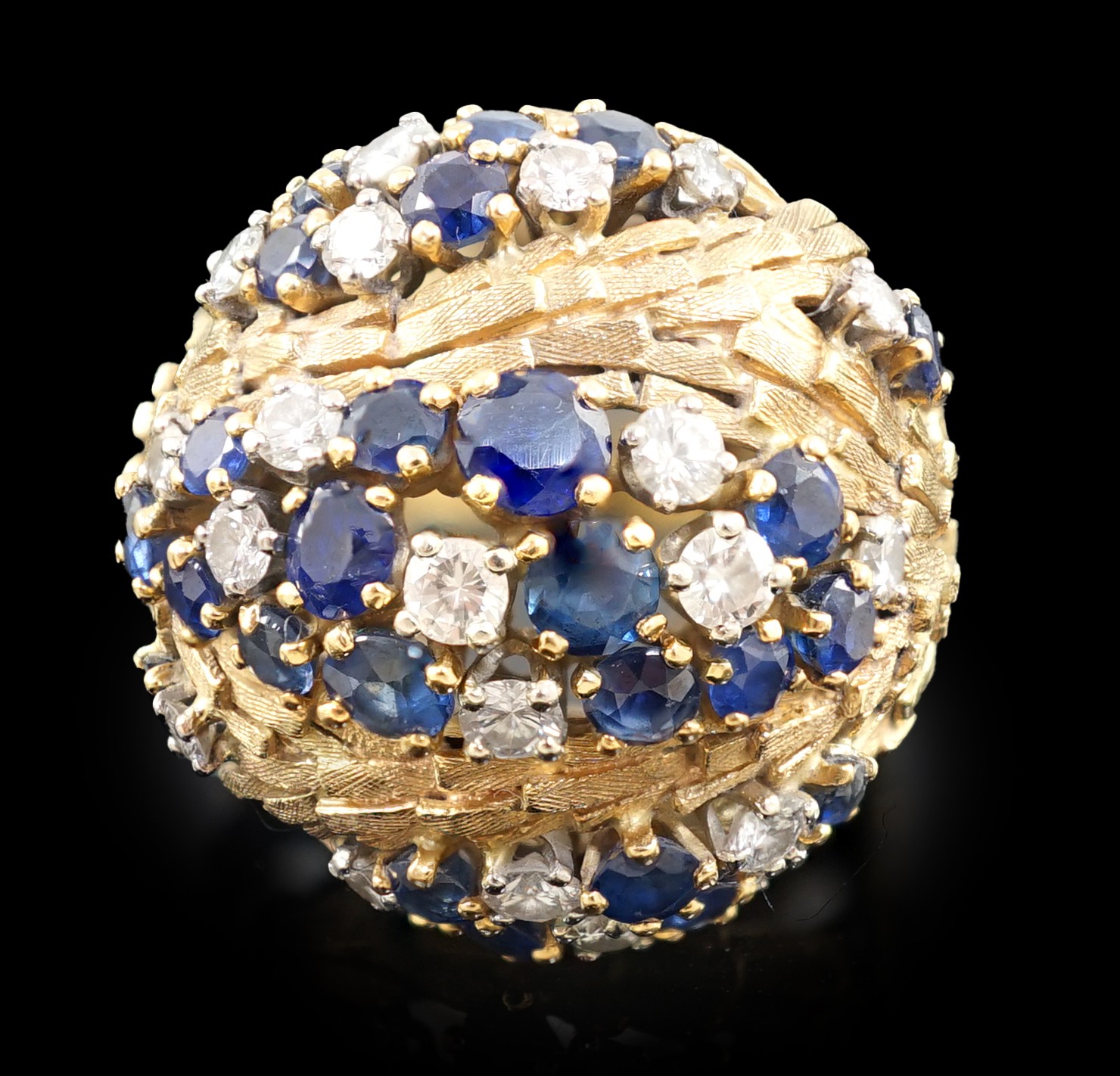 A mid 20th century textured 18ct gold, sapphire and diamond cluster set domed dress ring, by E. Meister, Zurich